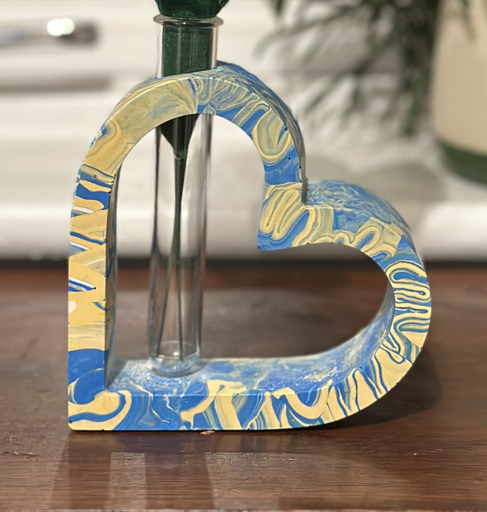 Single-stem heart shaped vase with test tube flower holder in blue and yellow marbled Jesmonite